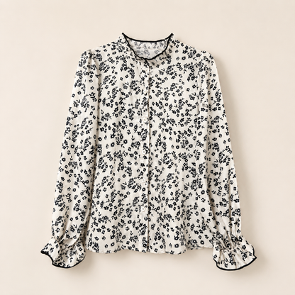 Floral patterned blouse on a beige background