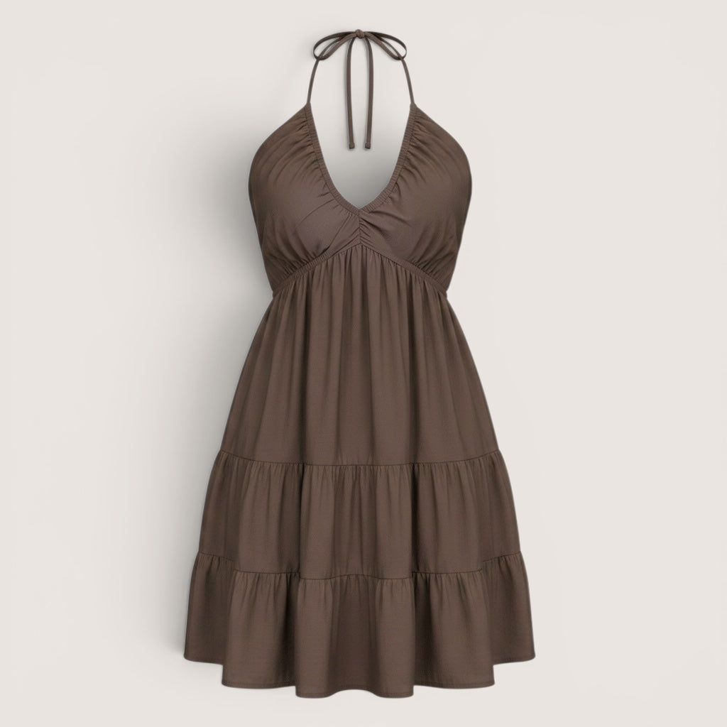 Brown halter neck dress on a light gray background