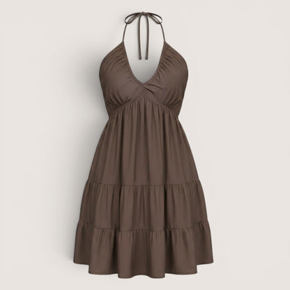 Brown halter neck dress on a light gray background
