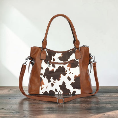 El bolso The Wild Spur con estampado de vaca