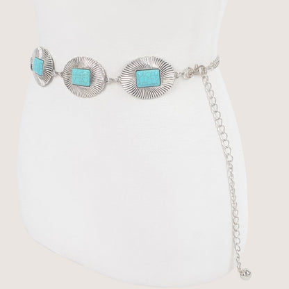 Silver bracelet with turquoise stones on a white background